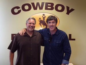 Wyoming head football coach Dave Christensen with Adam Ritz